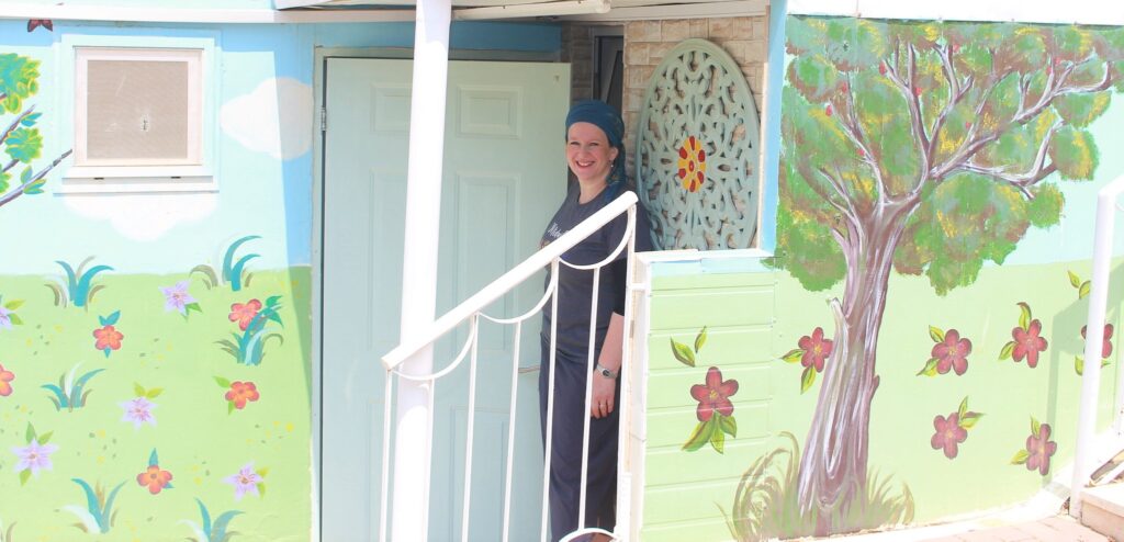 Sarah at door of Birthing Center