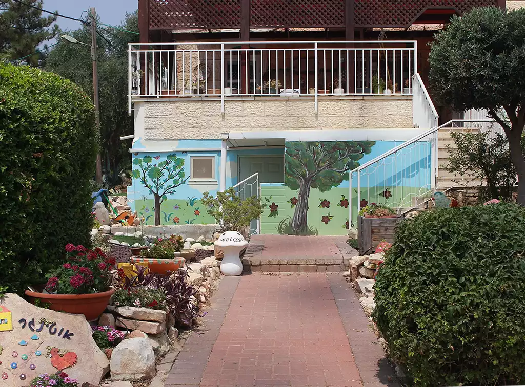 garden walkway and entrance of birthing center decorated with a garden mural